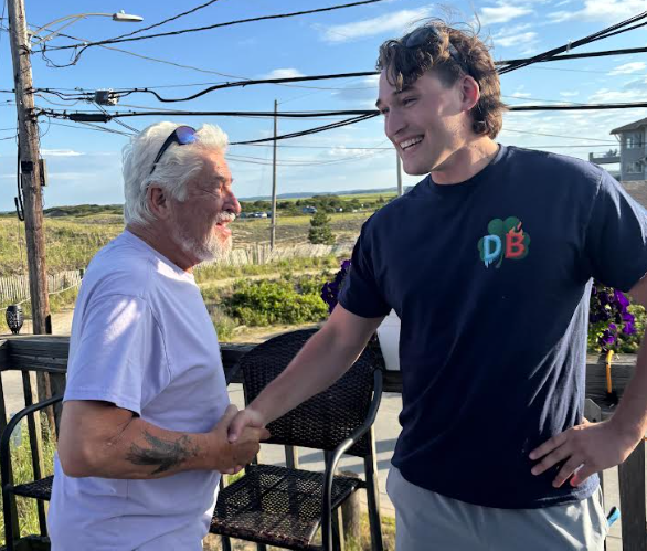 Customer shaking hands with Ductless Brothers